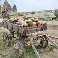 Buy canvas prints of On an old wooden cart, a pile of clay jugs and pots by Sergii Petruk