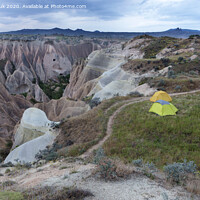 Buy canvas prints of Tourist tents on the trail with a splendid view of the Red Valley in Cappadocia by Sergii Petruk