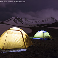 Buy canvas prints of Tents of tourists are located at the foot of Mount Erciyes in central Turkey by Sergii Petruk