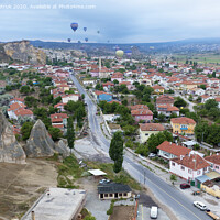 Buy canvas prints of Dozens of balloons fly over the valleys in Cappadocia by Sergii Petruk