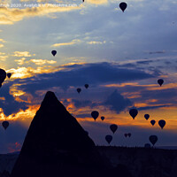 Buy canvas prints of Attraction dozens of balloons climbed into the night sky above the conical peaks of the rocks in Cappadocia by Sergii Petruk