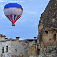 Buy canvas prints of Balloon flying over the old town of Cappadocia by Sergii Petruk