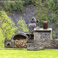 Buy canvas prints of Old stone stove with firewood and smokehouse in the mountains of the Carpathians. by Sergii Petruk