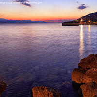 Buy canvas prints of Beautiful, bright sunset on the Corinthian bay at night Loutraki, Greece. by Sergii Petruk
