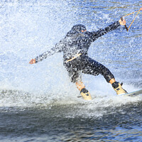 Buy canvas prints of Wakeboarder rushing through the water at high speed by Sergii Petruk