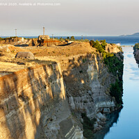 Buy canvas prints of Coastal fortifications of the Corinth Canal in Greece in the bright rays of the morning rising sun. by Sergii Petruk