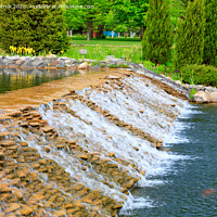 Buy canvas prints of The waters of a beautiful decorative waterfall flow rapidly in a summer park. by Sergii Petruk