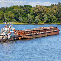 Buy canvas prints of A river tugboat with an empty rusty barge goes crosses a wide river. by Sergii Petruk