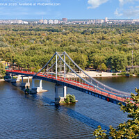 Buy canvas prints of Pedestrian park bridge over the Dnipro river in Kyiv on a sunny summer day. by Sergii Petruk