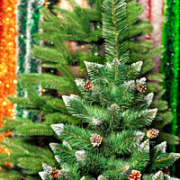 Buy canvas prints of Artificial Christmas pine on a background of multicolored tinsel in blur. by Sergii Petruk