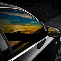 Buy canvas prints of Sunset reflections in Audi window and mirror by Will Badman