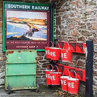 Buy canvas prints of Fire bucket at Southern railway station by David Belcher