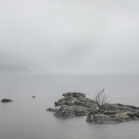 Buy canvas prints of Rocks in the rain at Loch Lomond by Peter Scott