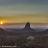 Buy canvas prints of A sunrise at Monument Valley. by Peter Scott