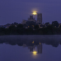 Buy canvas prints of Harvest Moon setting over Ely Cathedral, 21st September 2021 by Andrew Sharpe