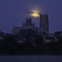 Buy canvas prints of Harvest Moon setting over Ely Cathedral, 21st September 2021 by Andrew Sharpe