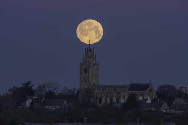 Wolf Moon setting over St Andrew's Chrurch, Sutton-in-the-Isle Picture Board by Andrew Sharpe