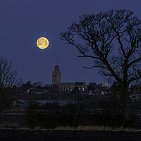Buy canvas prints of Wolf Moon setting over St Andrew's Chrurch, Sutton by Andrew Sharpe