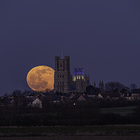 Buy canvas prints of Worm Moon rising behind Ely Cathedral, 18th March 2022 by Andrew Sharpe