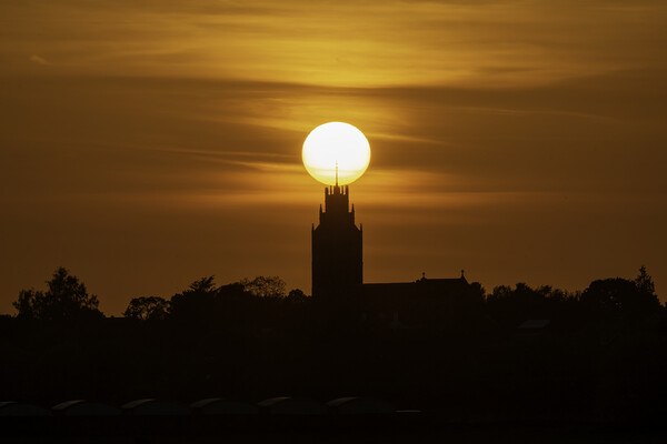 Sunset behind St Andrew's Church, Sutton-in-the-Isle, Cambs Picture Board by Andrew Sharpe