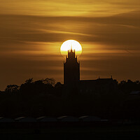 Buy canvas prints of Sunset behind St Andrew's Church, Sutton-in-the-Isle, Cambs by Andrew Sharpe