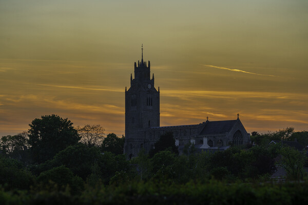 Sunset behind St Andrew's Church, Sutton-in-the-Isle, Cambs Picture Board by Andrew Sharpe