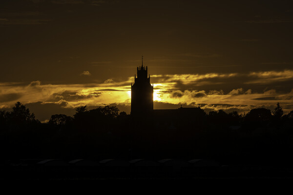 Sunset behind St Andrew's church, Sutton-in-the-Isle, Cambridges Picture Board by Andrew Sharpe