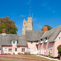Buy canvas prints of The pink cottages, in front of St Mary's Church, C by Andrew Sharpe
