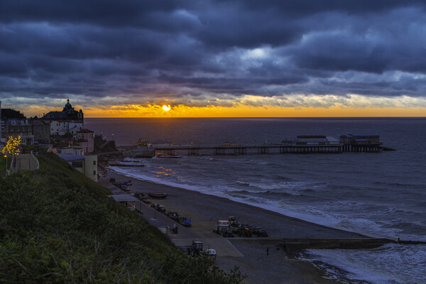 Sunset over Cromer Pier, Norfolk Picture Board by Andrew Sharpe