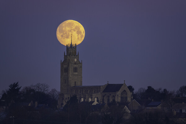 Snow Moon (or Hunger Moon) setting behind St Andrew's Church, Su Picture Board by Andrew Sharpe