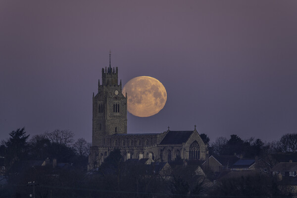 Snow Moon (or Hunger Moon) setting behind St Andre Picture Board by Andrew Sharpe