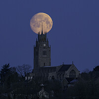 Buy canvas prints of Moonset behind St Andrew's Church, Sutton-in-the-Isle, Cambridge by Andrew Sharpe