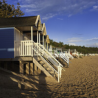 Buy canvas prints of Beach-huts on Wells-next-the-Sea beach, North Norfolk coast by Andrew Sharpe