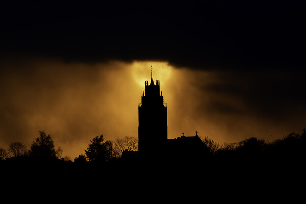 Sunset behind St Andrew's Church tower Picture Board by Andrew Sharpe