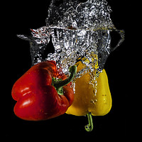 Buy canvas prints of Red and Yellow pepper dropped in Water  by Julia Watkins