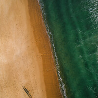 Buy canvas prints of Long shadow of couple walking on beach by Alexandre Rotenberg