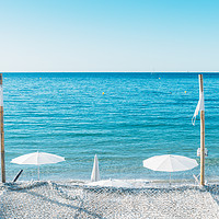 Buy canvas prints of Giant white beach umbrella next to the ocean again by Alexandre Rotenberg