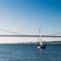 Buy canvas prints of Sailboat with April 24 Bridge, Lisbon by Alexandre Rotenberg