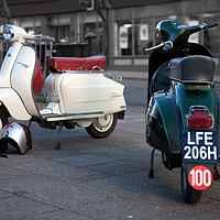 Buy canvas prints of Vespa Sprint and Lambretta Li in town by Donnie Canning