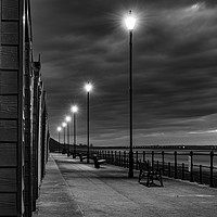 Buy canvas prints of Beach Huts at sunset in Black and White by John Stoves