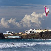 Buy canvas prints of Surfers Beach Kite Surfer, El Cotillo, Fuerteventu by John Parker