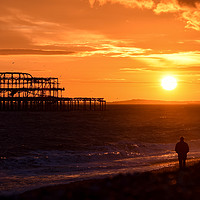 Buy canvas prints of West pier sunset watcher by Roger Utting