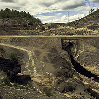 Buy canvas prints of Big black rock and stone bridge in the mining comp by Juan Ramón Ramos Rivero