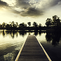 Buy canvas prints of Wooden jetty over the lake with reflections by Juan Ramón Ramos Rivero