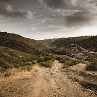 Buy canvas prints of Very steep dirt road that leads to the Guadiana Ri by Juan Ramón Ramos Rivero