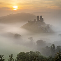 Buy canvas prints of Misty Sunrise at Corfe Castle by David Semmens
