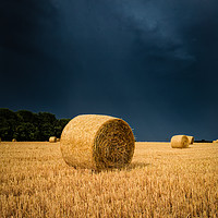 Buy canvas prints of Summer Thunder Storm over the Hay bails by James Aston