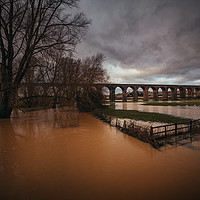 Buy canvas prints of A fully flooded Harringworth Viaduct  by James Aston