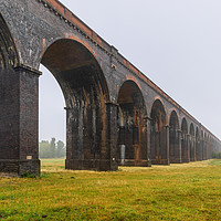 Buy canvas prints of Misty Start to the Morning at Harringworth Viaduct by James Aston