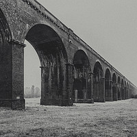 Buy canvas prints of Misty Start to the Morning at Harringworth Viaduct by James Aston